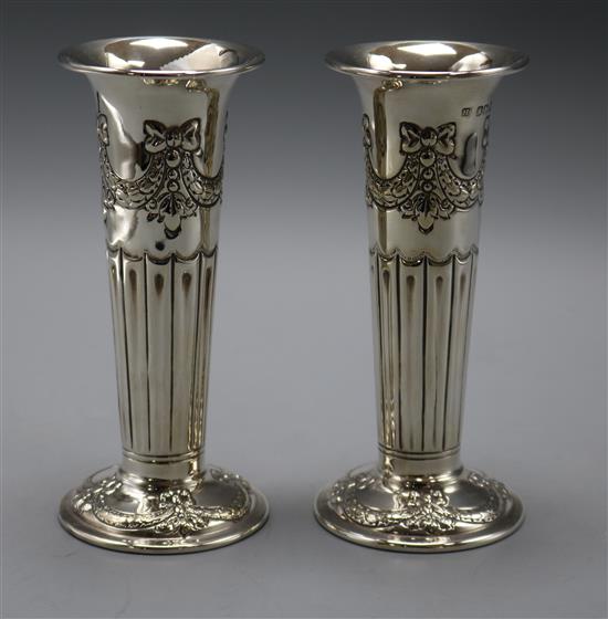 A pair of late Victorian repousse silver spill vases, by Atkin Brothers, Sheffield, 1892, 6.5 oz.